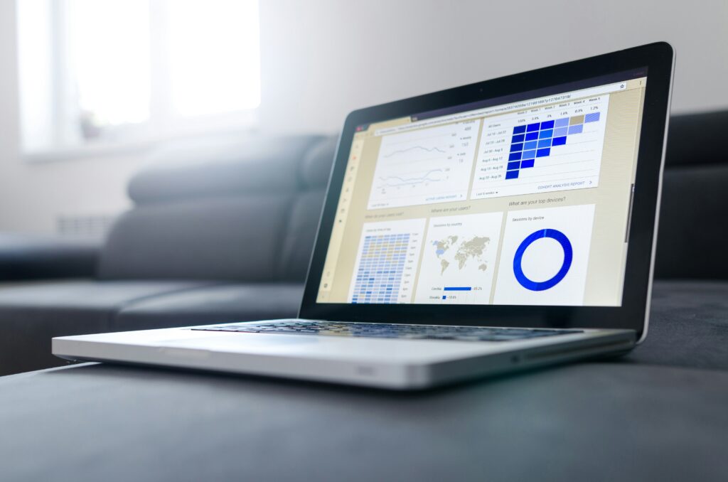 macbook with google analytics displayed analyzing website design for companies